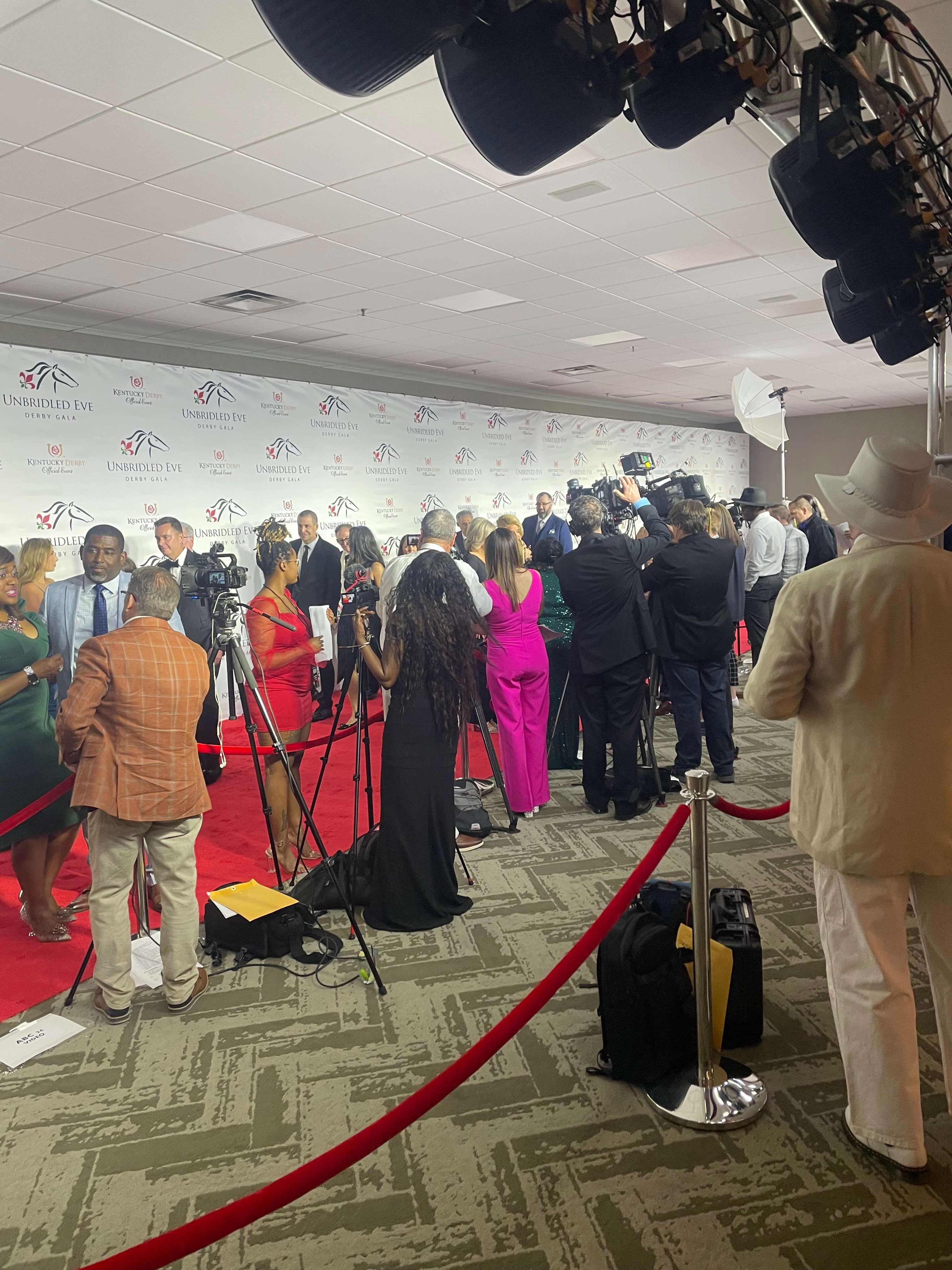 Media and guests gathered along a red carpet at a nationally recognized gala